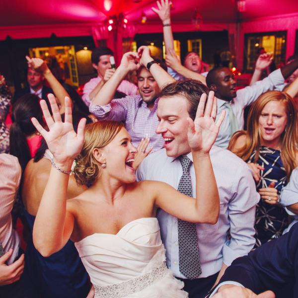 bride and groom with guests at wedding party